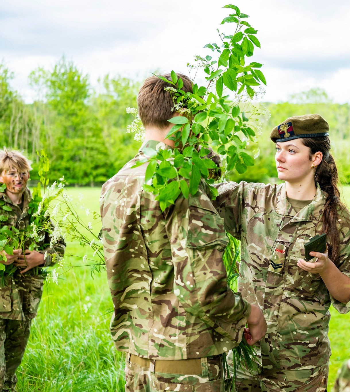 Students in CCF cadet uniforms practising outdoor fieldcraft, providing excellent co-curricular activities learning opportunities.